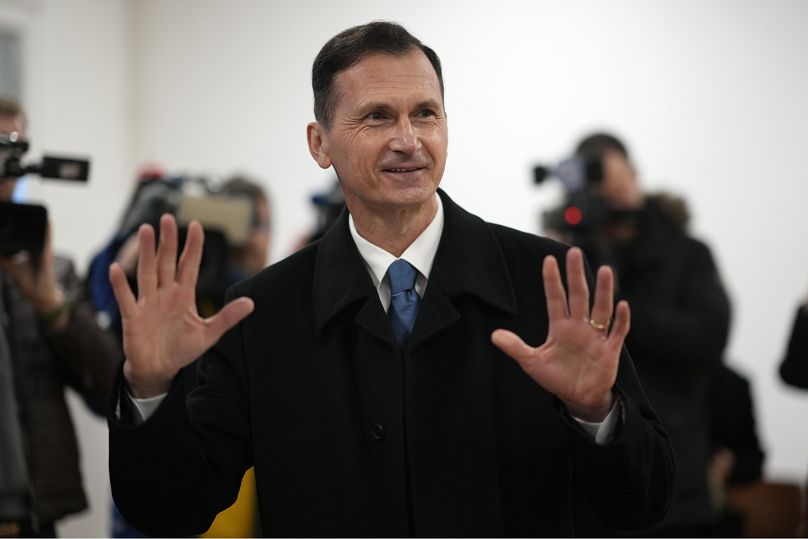 Presidential candidate Dragan Primorac prepares to cast his vote at a polling station in Zagreb, 12 January, 2025